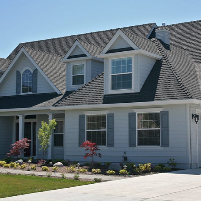 Two-story O'Fallon MO area home with new architectural shingles and seamless gutters